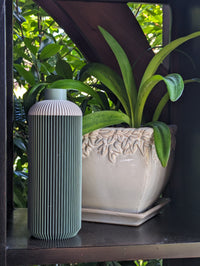 The Serenity Vase is an excellent choice for those who appreciate both plant life and contemporary design. Crafted from sustainably sourced wood, this vase is perfect for showcasing dried or fresh flowers and adds a unique touch to any living space.