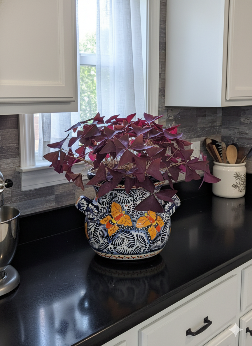 Decorative vase with purple leaves on a kitchen counter