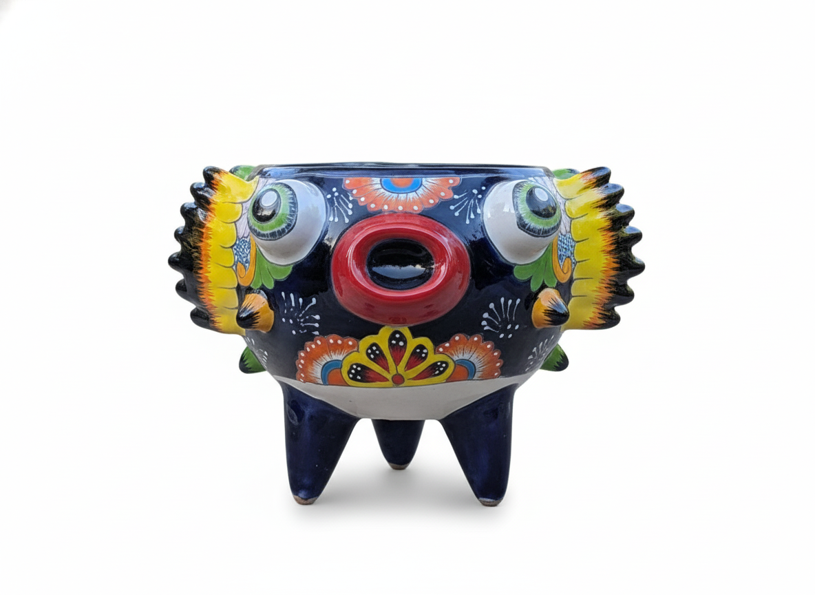 Colorful ceramic pot with abstract design on a white background