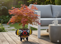 Colorful planter with a small tree on a wooden deck, next to a gray sofa and coffee table.
